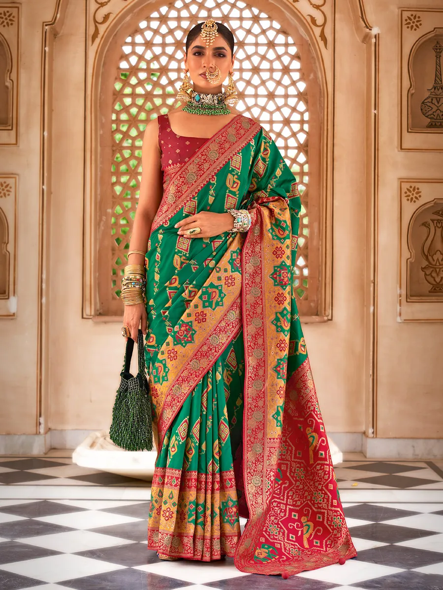 Dark green designer patola silk saree