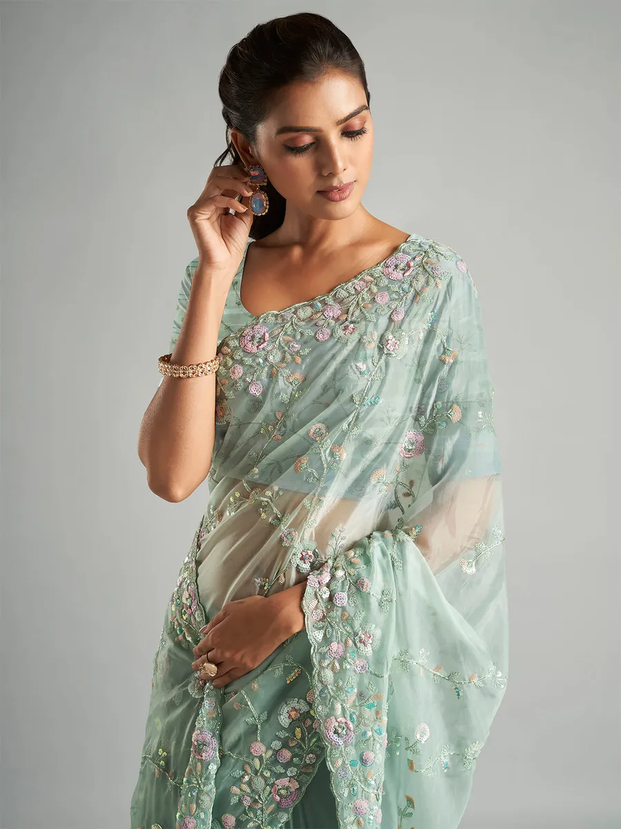 Elegant mint green organza saree