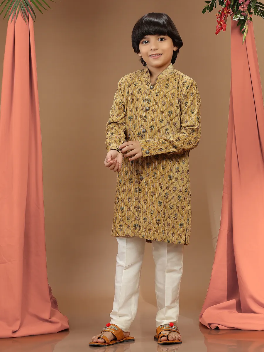 Mustard yellow printed velvet kurta suit for festive