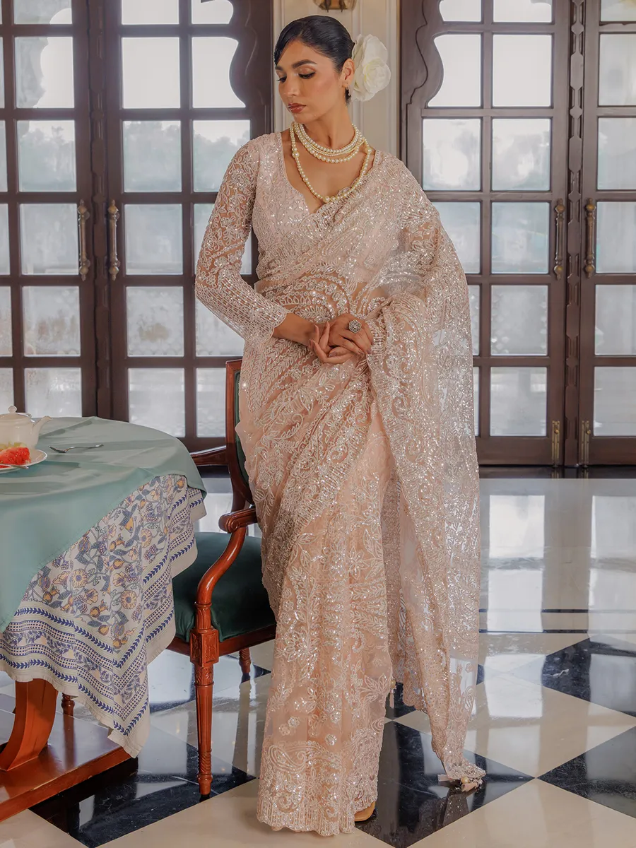 Peach sequins worked saree in soft net