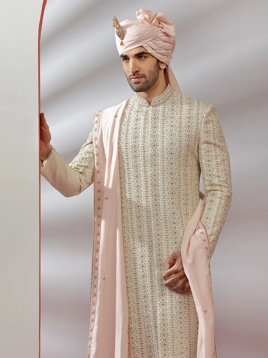 Raw silk fabric cream hue sherwani for groom