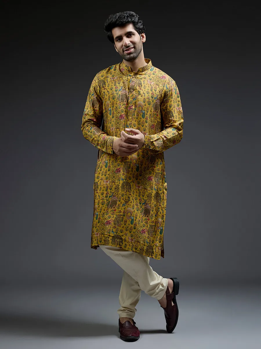 Rich mahendi yellow silk kurta suit in applique print
