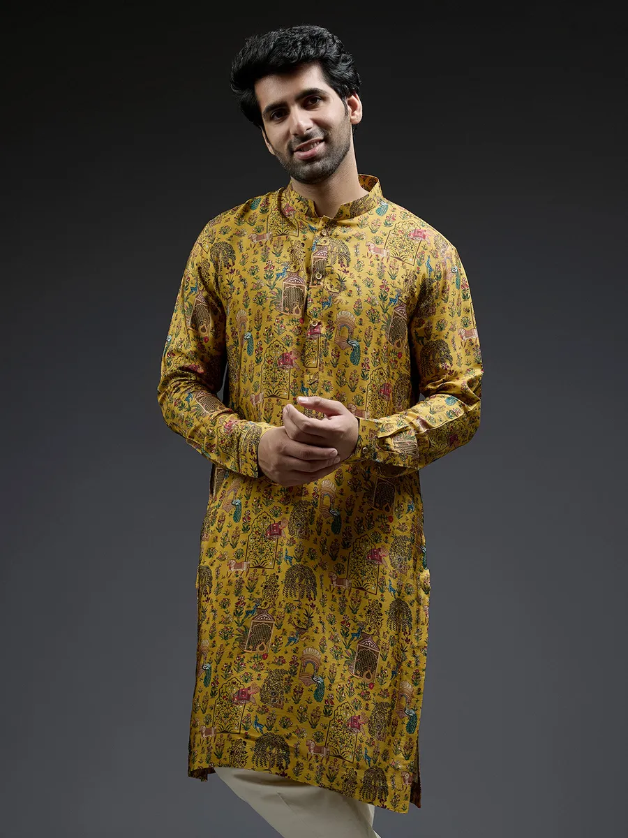 Rich mahendi yellow silk kurta suit in applique print