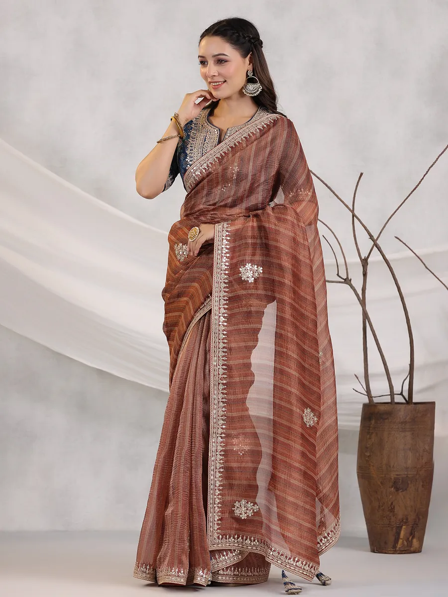 Rust orange organza saree for wedding