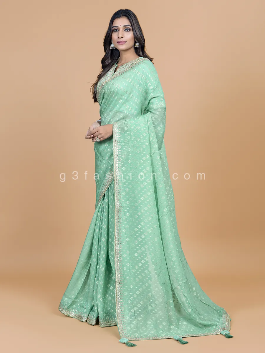 Sea green georgette saree for wedding look