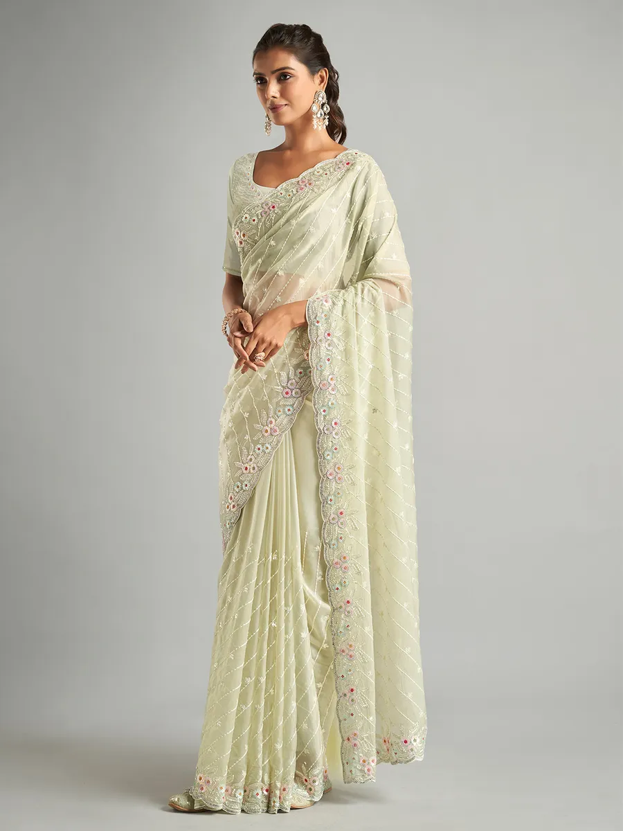 Stunning light green organza saree