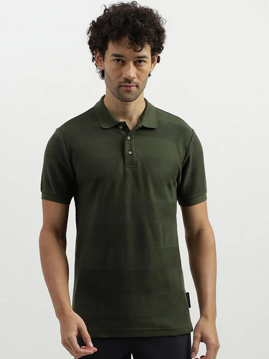 UCB dark green stripe t shirt
