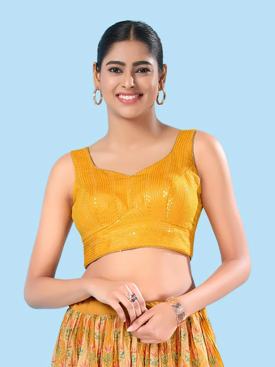 Yellow brocade sleeveless blouse