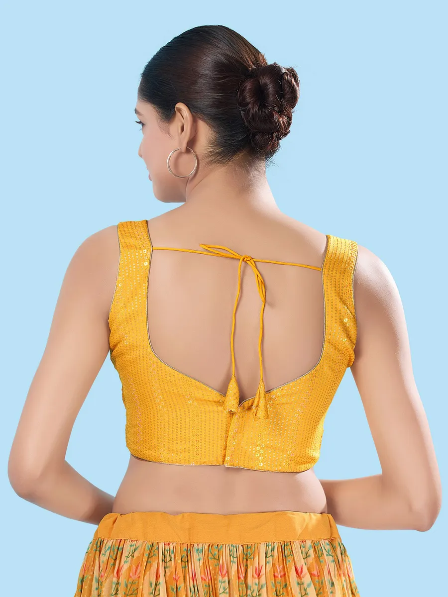 Yellow brocade sleeveless blouse