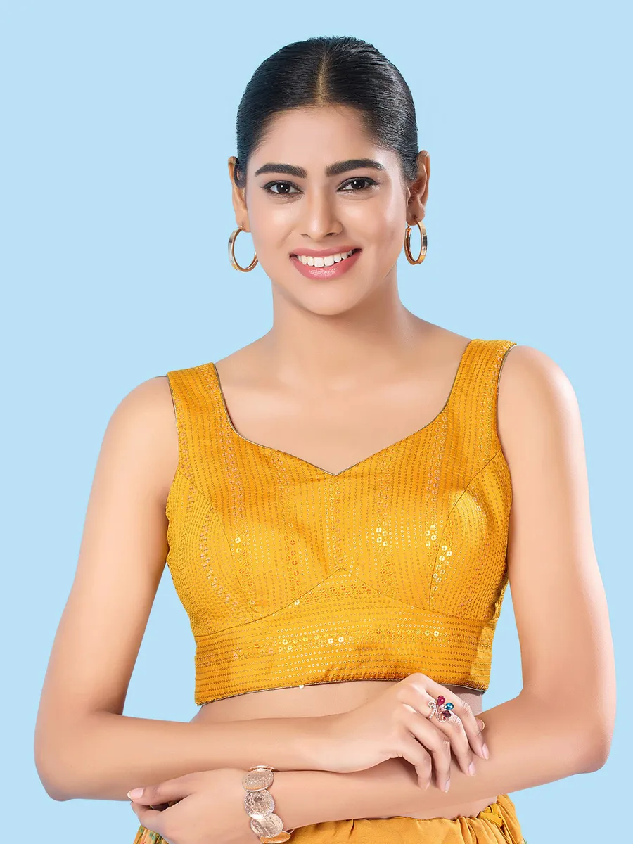 Yellow brocade sleeveless blouse