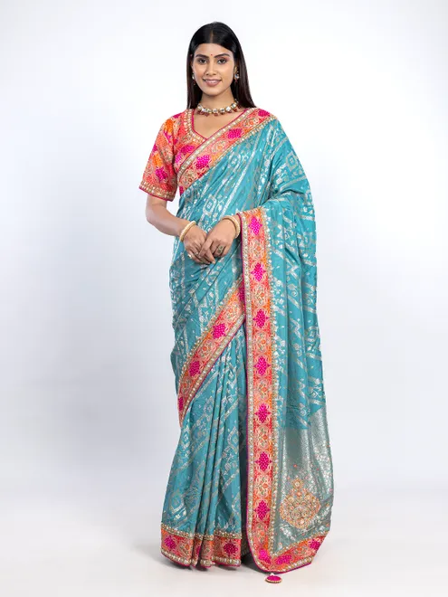 Aqua dola silk saree with orange blouse