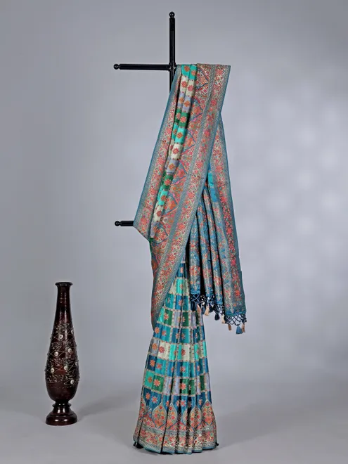 Aqua green printed mashru silk saree with zari detailing