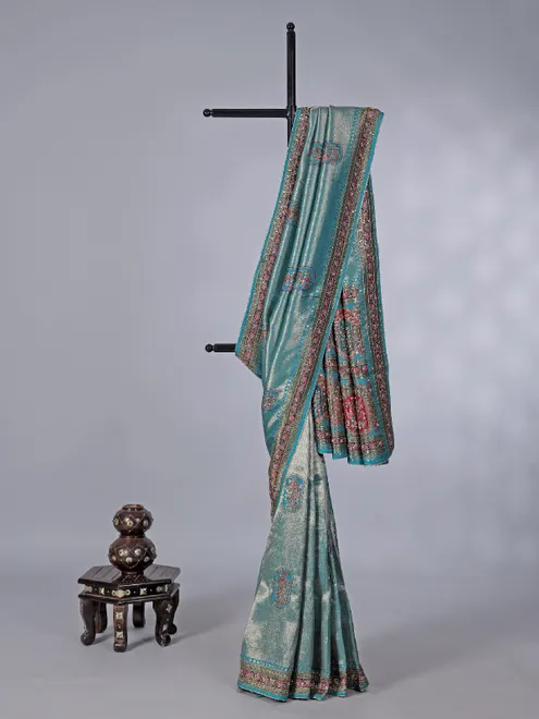 Aqua modal tissue silk saree with festive motifs