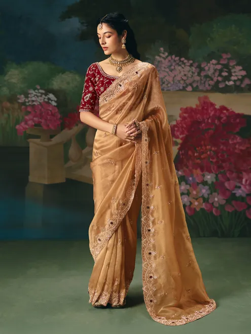 Beige chinon silk saree with contrast heavy work blouse