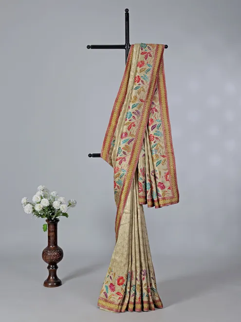 Beige dola silk saree with florals colorful motifs