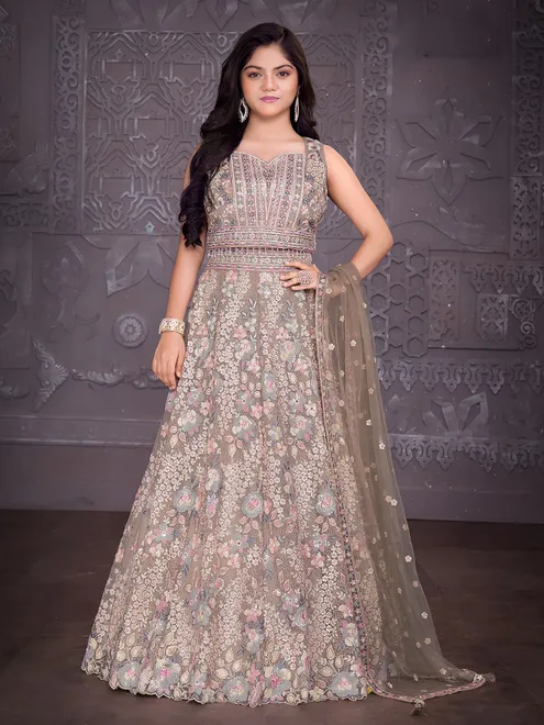 Beige net lehenga choli with diamond embellishments