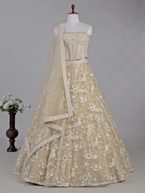 Beige net lehenga choli with sequins work