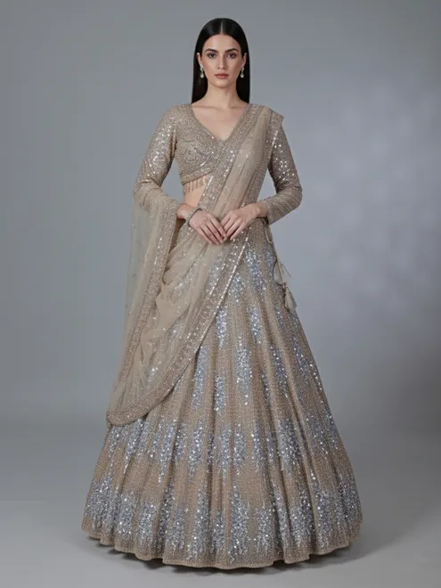 Beige net reception wear lehenga choli with rich sequins work