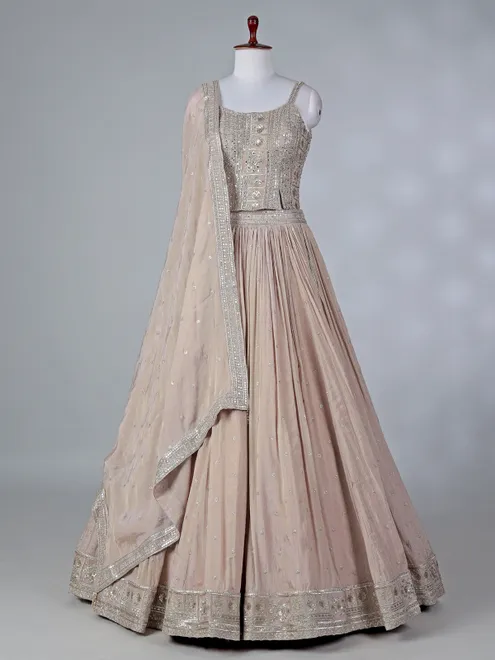 Beige silk lehenga choli with mirror embellishments