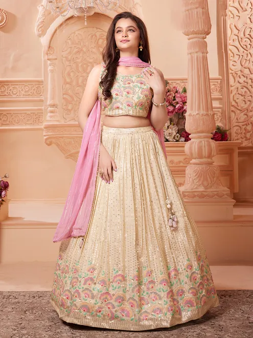 Beige silk lehenga choli with regal embellishments