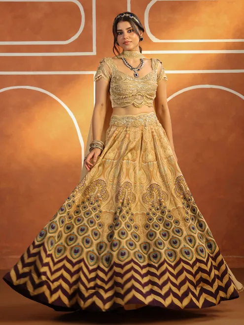 Beige silk printed lehenga choli with rich embellished choli