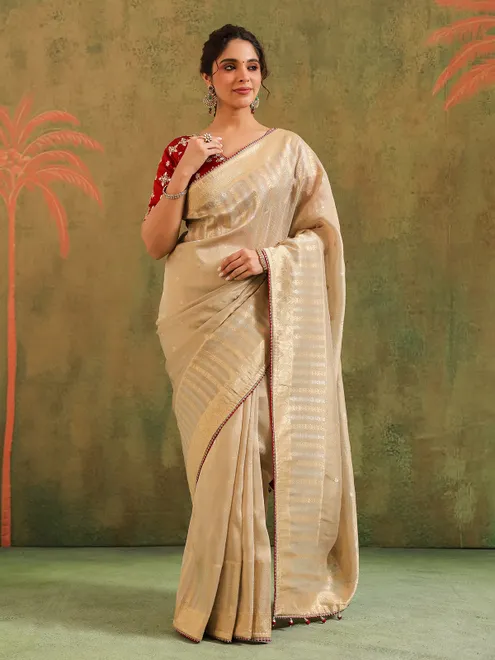 Beige silk saree with maroon contrast blouse festive wear