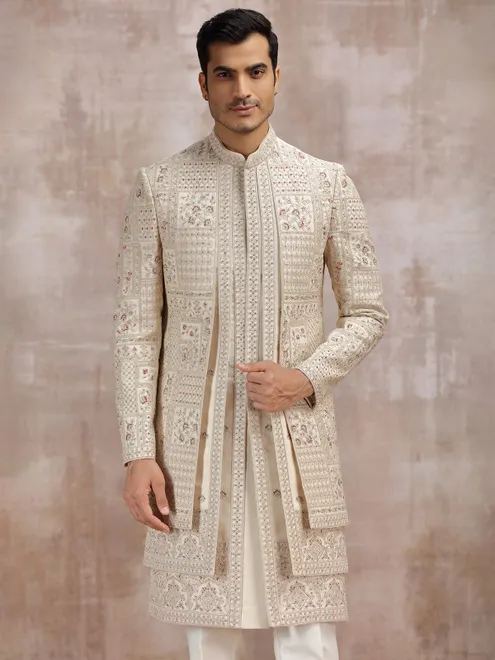 Beige silk sherwani adorned with rich resham work
