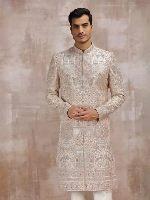Beige silk sherwani with intricate embellishments