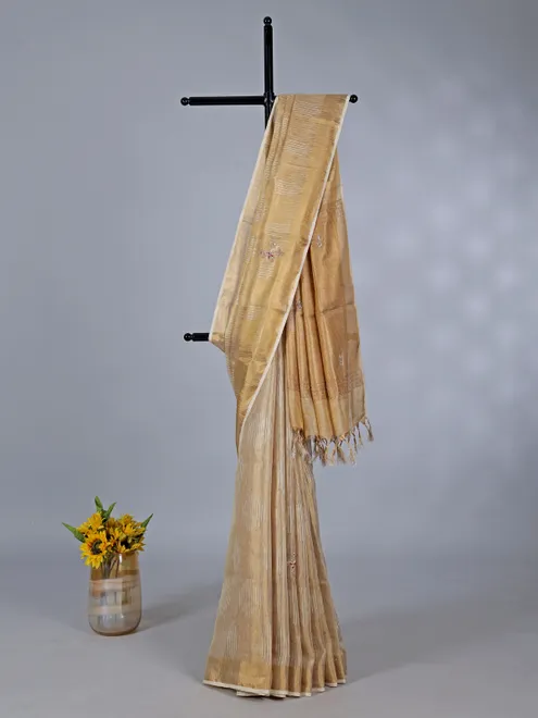 Beige tissue silk saree with cutdana work