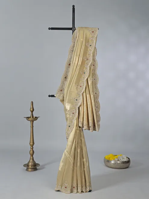 Beige tissue silk saree with diamond highlights