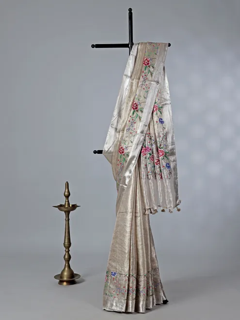 Beige tissue silk saree with thread and zari work