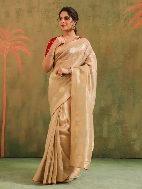 Beige zari worked silk saree with maroon blouse