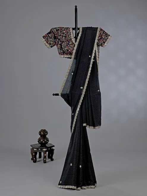 Black muslin silk printed saree with festive detailing