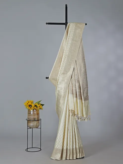 Cream art silk zari embellished traditional wear saree