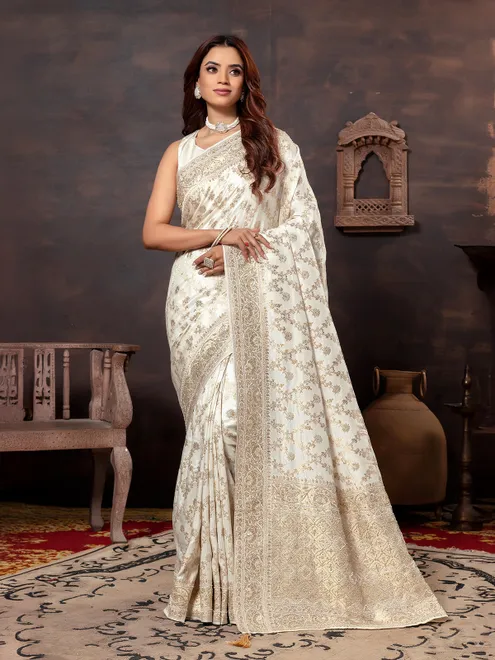 Cream dola silk saree with zari embellishment