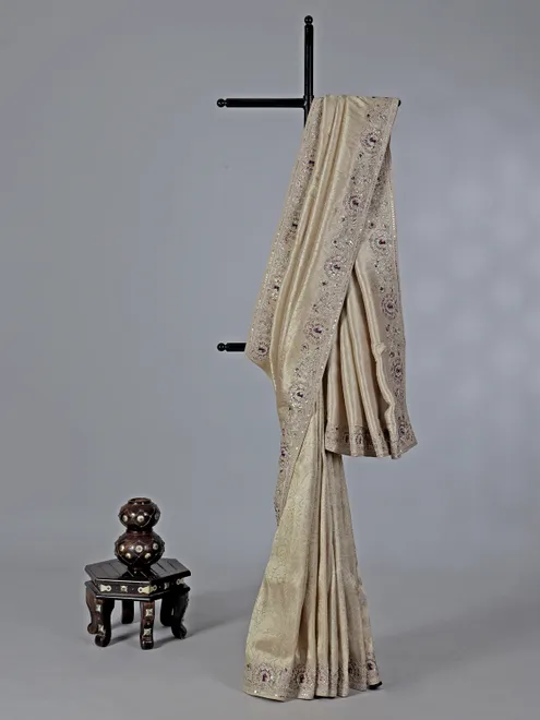 Cream embroidered tissue silk saree