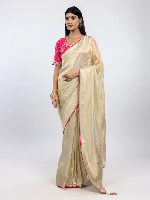 Cream festive wear saree in shimmer tissue silk