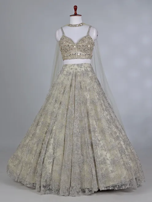 Cream net bridal lehenga choli with zardosi work