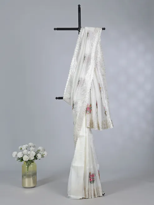 Cream organza saree with sequins detailing