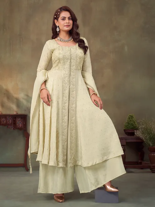 Cream pakistani silk suit with intricate embellishments for women