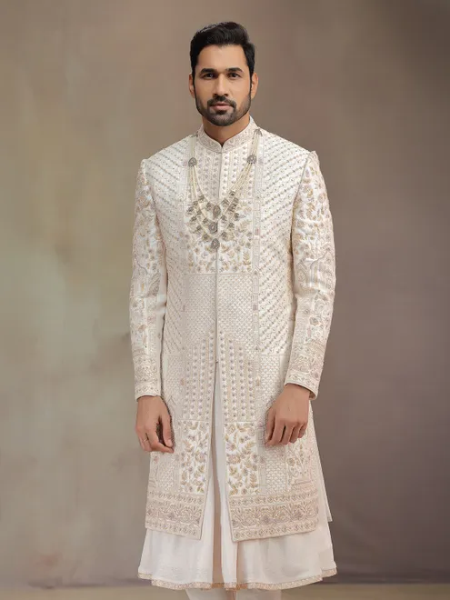 Cream peshwa style silk sherwani with rich embroidery