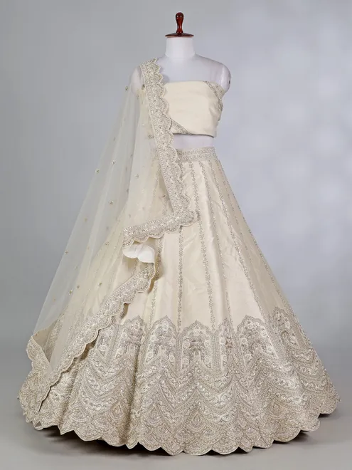 Cream raw silk lehenga choli with cutdana embellishments