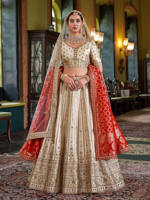 Cream silk bridal lehenga choli with red dupatta