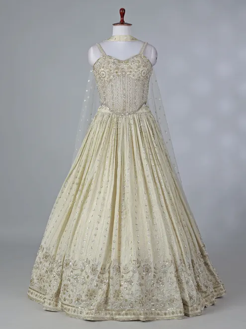 Cream silk lehenga choli with beaded detailing