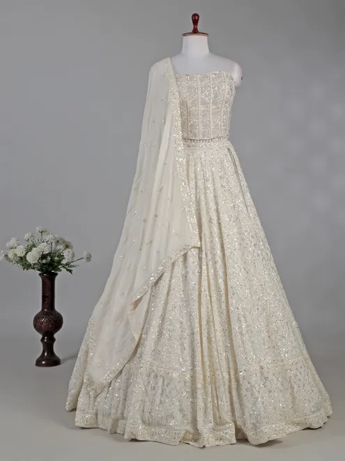 Cream silk lehenga choli with cutdana and sequins