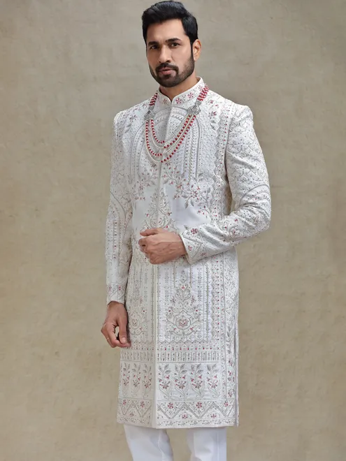 Cream silk sherwani in rich embellishment