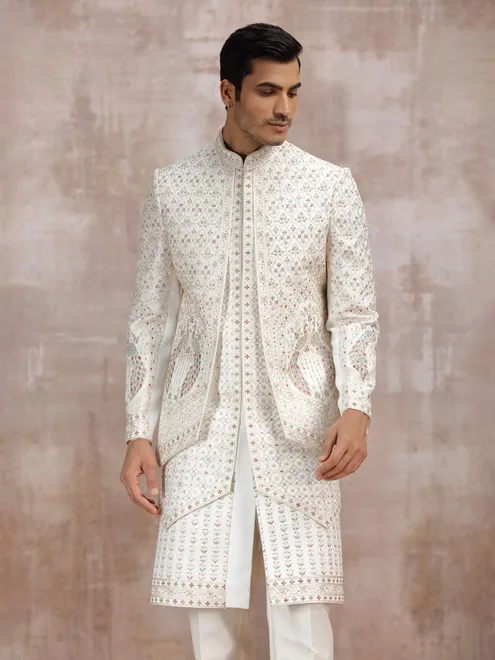 Cream silk sherwani with elegant resham detailing