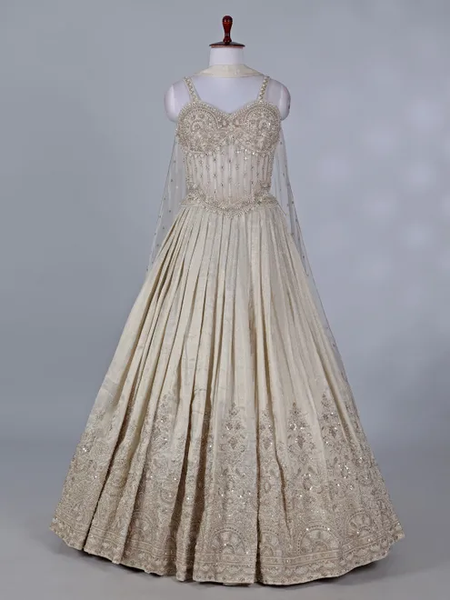 Cream wedding wear lehenga choli in brocade silk