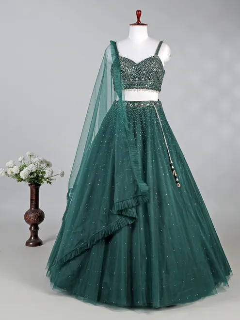 Dark green net lehenga choli with shimmering sequins
