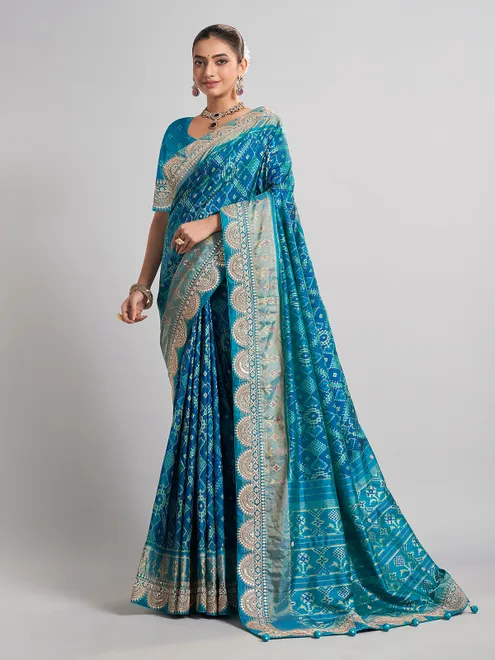 Embellished blue patola silk saree for grand festivities